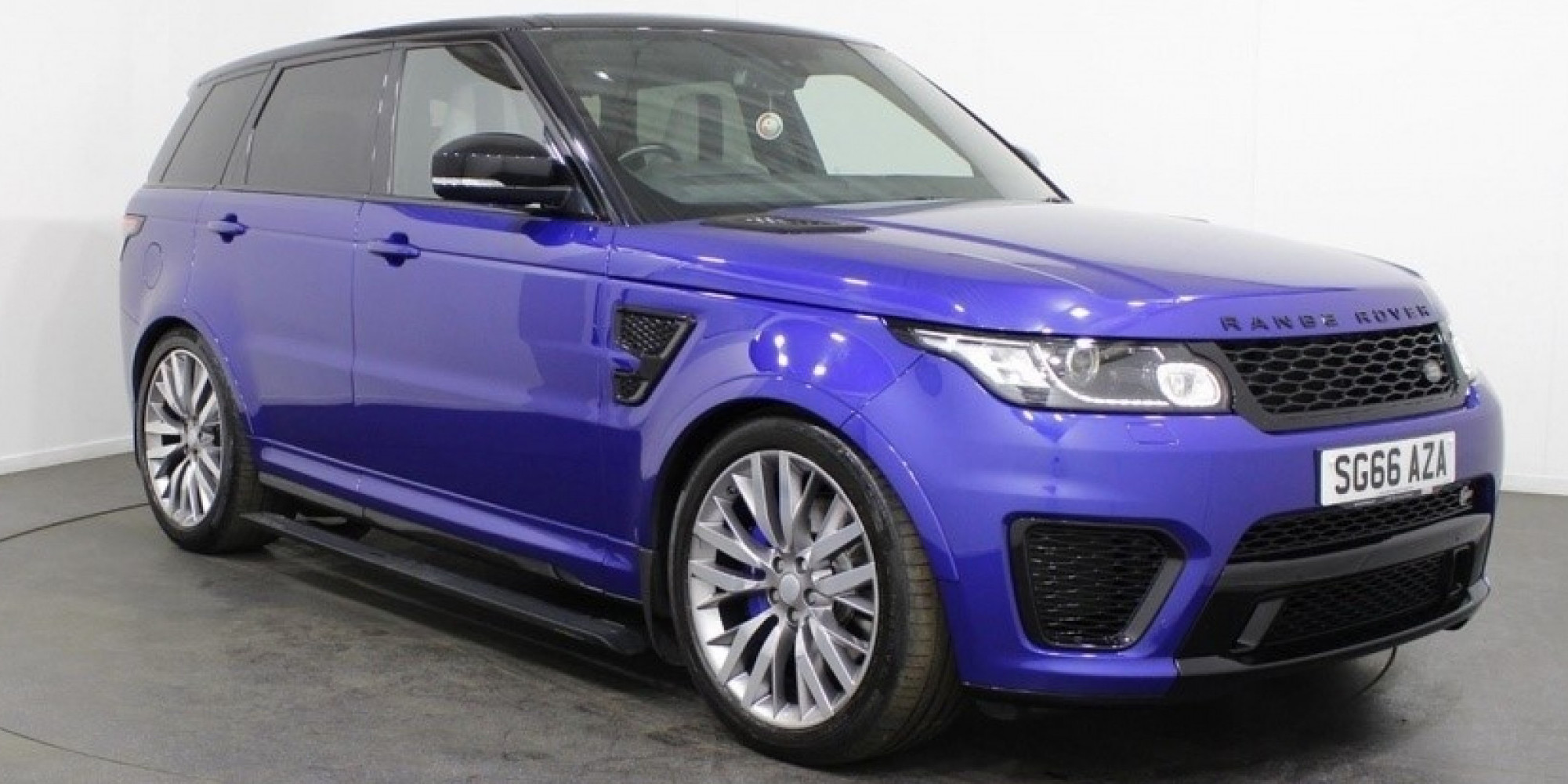 Blue Range Rover Sport SVR parked three-quarters facing right